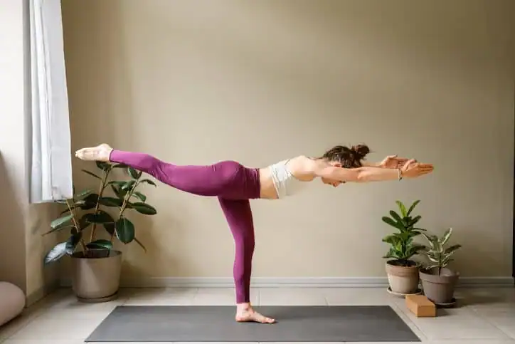 Woman doing Yoga exercise Northwich to help with toning the body. 