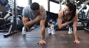 Sculpting Sleek Arms: The Essential Role of Cardio in Toning Without Bulking Up 1 Image of man and woman doing Cardio Northwich to tone their arms.
